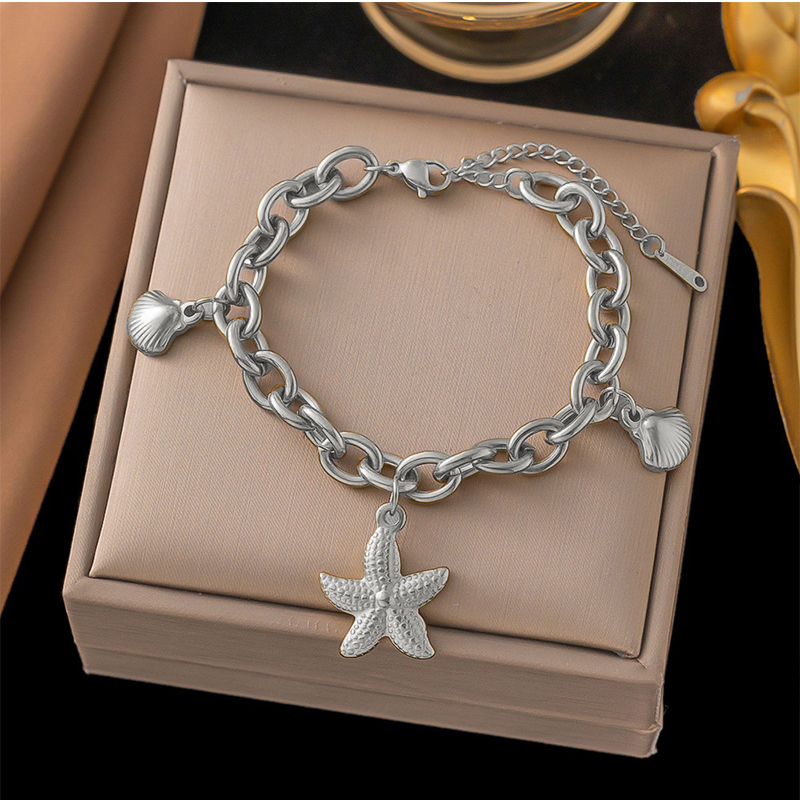 Brazalete Plateado con Dijes Marinos